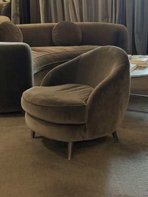 a living room with a couch, chair, and coffee table in it
