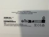 the back of a white box with a black and white sticker on it
