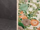 an image of a picture of a vase with flowers and leaves on it