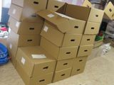 boxes stacked on top of each other in a room filled with clutter