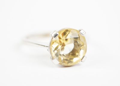 a close up of a ring with a citrine stone in it