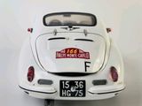 a white car with a sticker on the back of it
