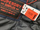 a close up of a jacket with a tag attached to it