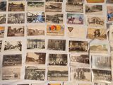 a lot of old photos on the table together