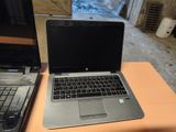 two laptops that are sitting on a table