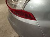 a close up of a car tail light on the back of the car
