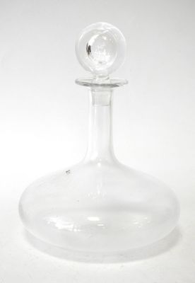clear glass decanter with a clear base on a white surface