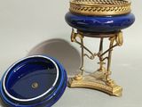 a small blue bowl sitting next to a small blue bowl