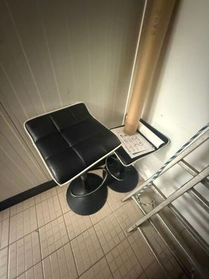 a chair that is sitting in the corner of a room