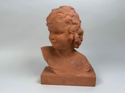 an image of a clay bust of a child on a white background