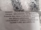 packaging of a pair of scissors sitting on top of a pile of plastic wrap