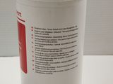 a white container with a red label on it on a table