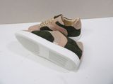 a close up of a pair of sneakers on a white surface