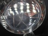 a clear glass plate with a clock inside of it