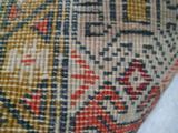 an image of a close up of a rug with a cat on it ' s back