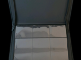 an open suitcase with a lot of papers inside of it