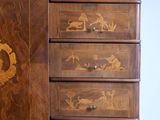 a wooden cabinet with a mirror on top of it
