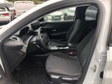 the interior of a car with the door open and the driver ' s seat down