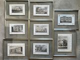 many pictures of old buildings displayed on the wall