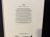 the back of a white box with a green logo on it