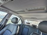 the interior of a car with blue leather seats and a sunroof