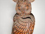 an image of a wooden owl statue on a white background