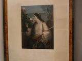a framed picture of a man with a sword in a room