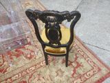 a chair that is sitting on a rug on the ground
