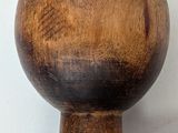 a close up of a wooden ball on a table