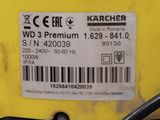 the back end of a yellow tractor with a barcode on it