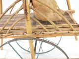 a teddy bear sitting on top of a wooden chair