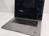 a laptop that is sitting on a white surface