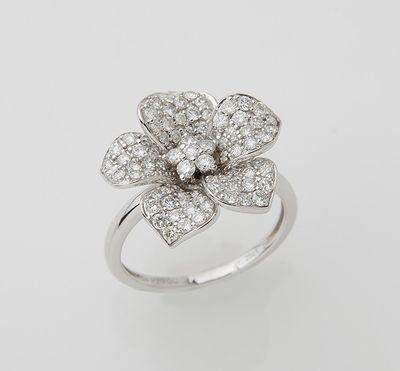 a white gold and diamond flower ring