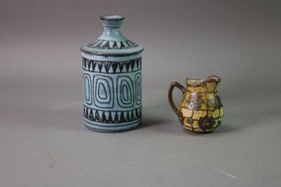 two vases sitting next to each other on a table