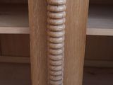 a wooden door handle with a spiral design on it