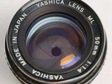 a close up of a camera lens on a white surface