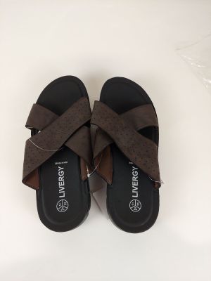 une paire de sandales marron pour femme ornées de nœuds, posées sur un fond blanc