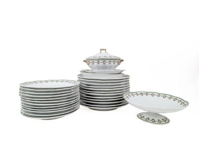 a stack of plates and bowls on a white table