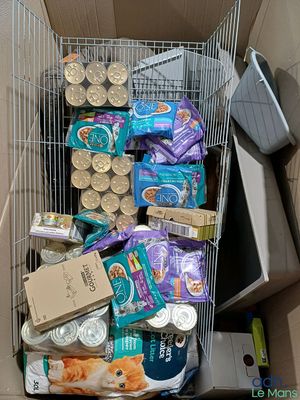 a cart full of food and other items in it
