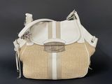beige and white handbag on black background with silver hardware