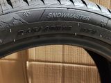 a close up of a tire on a box with boxes in the background