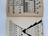 an open book with a black and white image of a clock on it