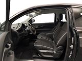 the interior of a car with the door open and the driver ' s seat up