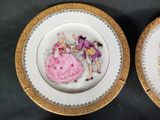 two plates with a picture of a man and a woman on them