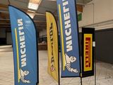 two blue and yellow flags on display in a building
