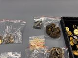 a lot of gold and silver coins in a case