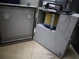 two refrigerators that are next to each other on the floor