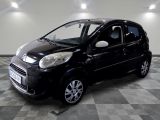 a picture of a small black car parked in a garage
