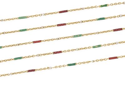 a close up of a row of gold chains with green and red beads