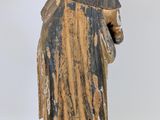 an old statue of a woman with a veil on her head